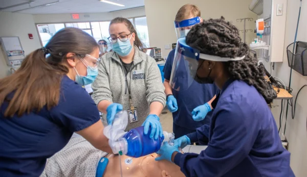 UConn Nursing students applying practices in a simulated setting.
